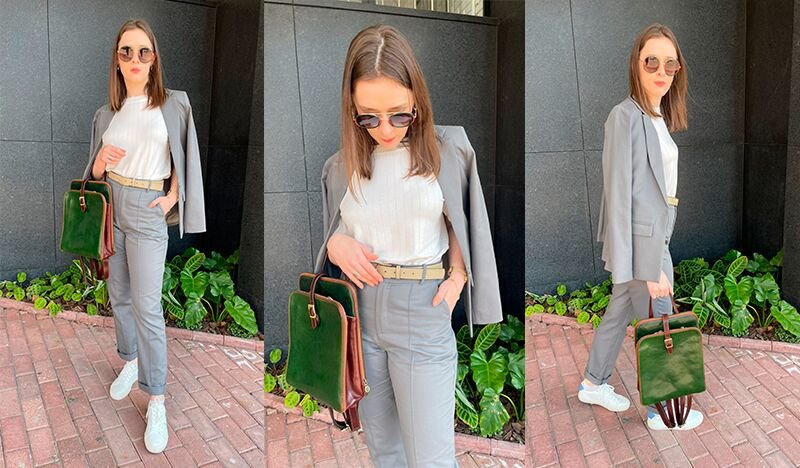 mulher traje cinza bolsa verde